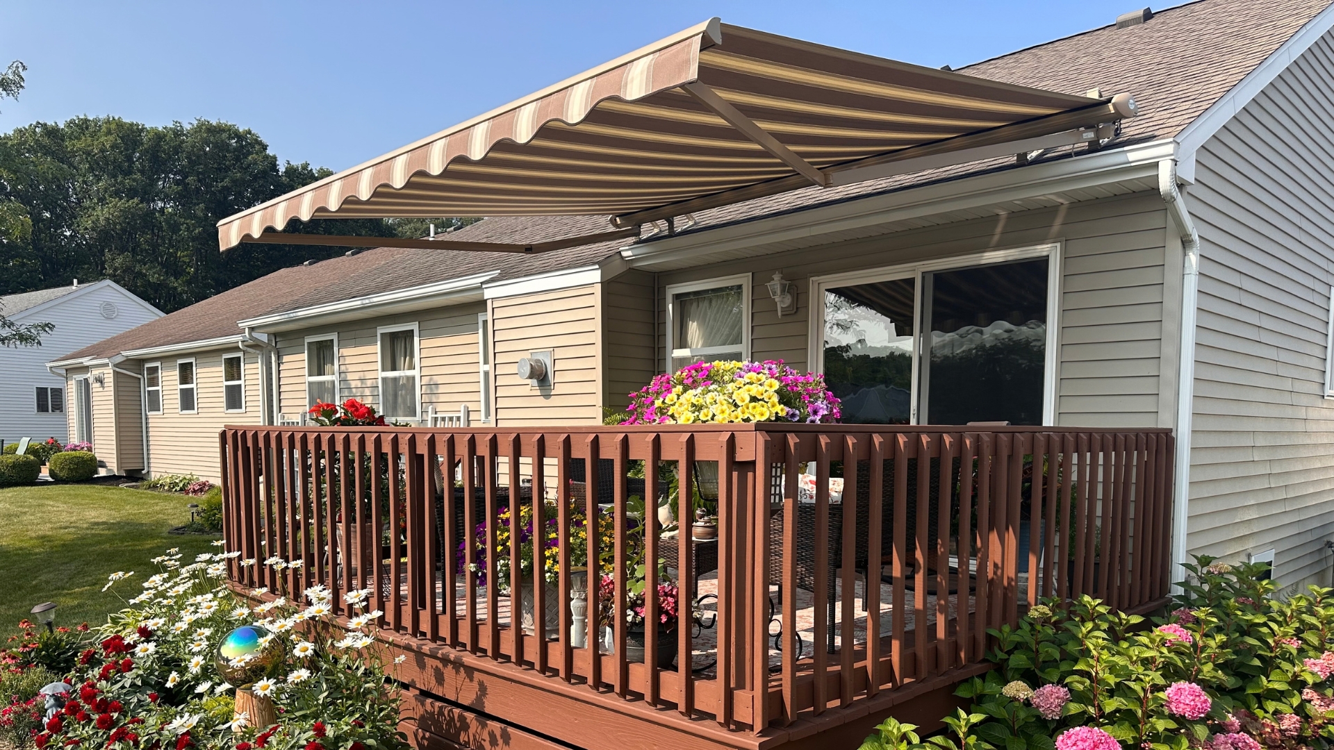 Custom retractable awning extended over a residential patio