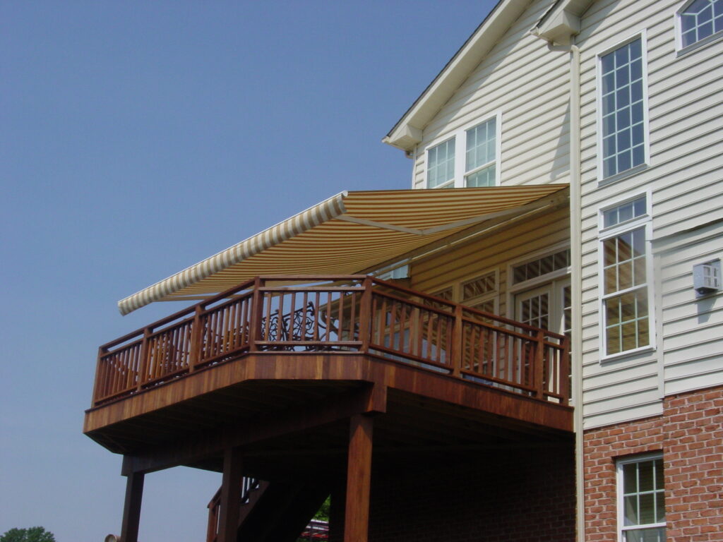 Sunesta awning creating shade for a raised deck.