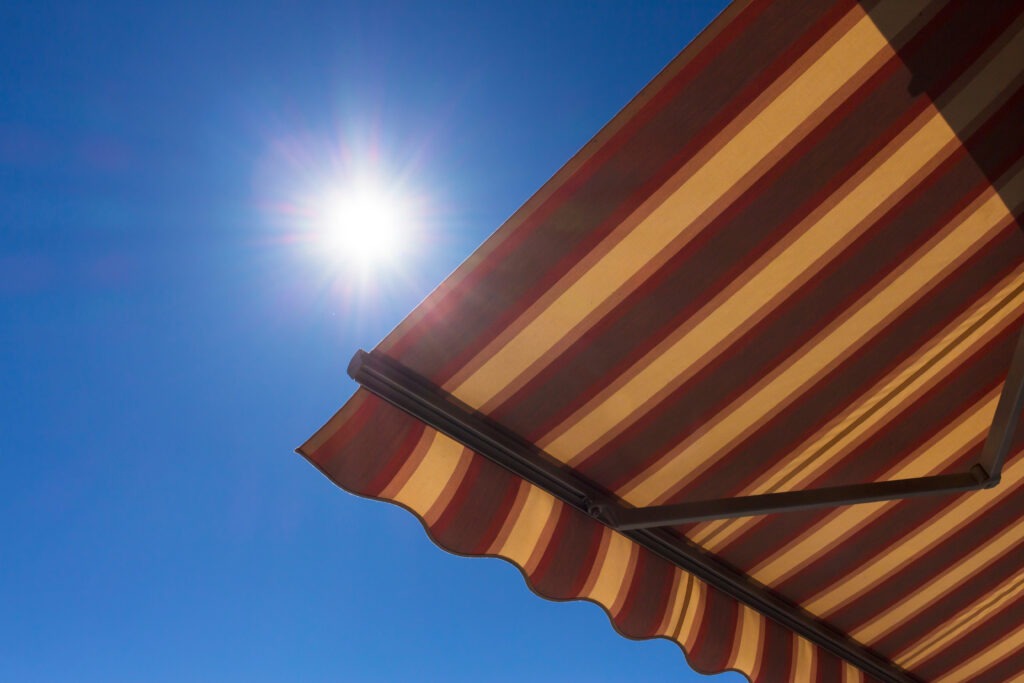 Sun beaming down, but blocked by a perfectly installed retractable awning by Elite Awnings.